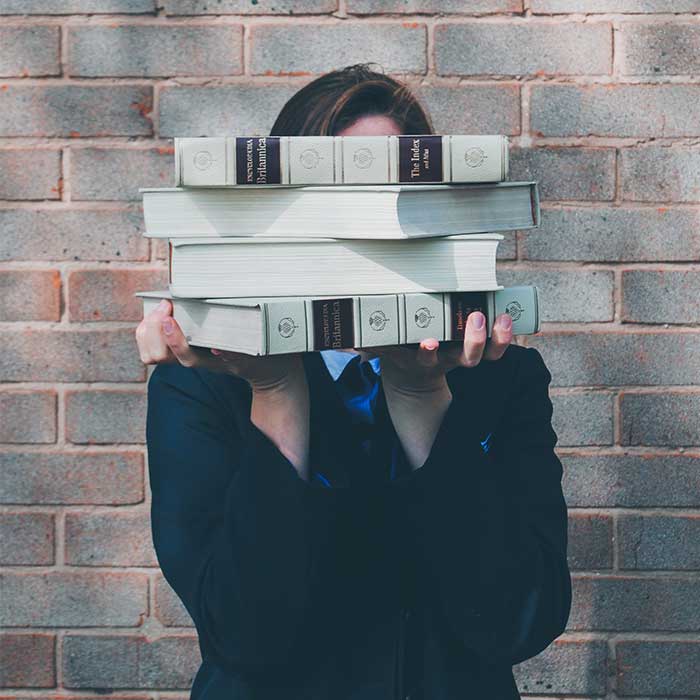 About Us - Students with Books